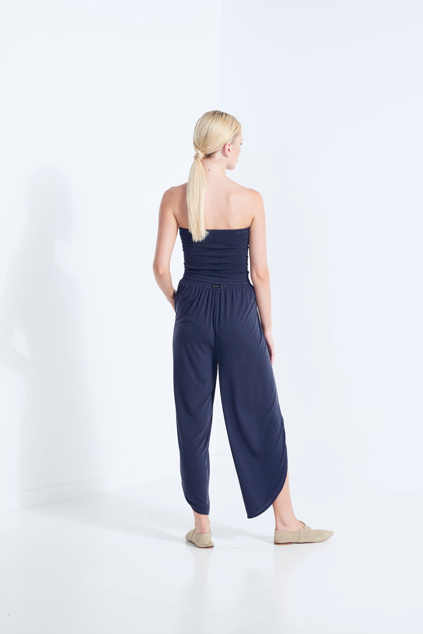 BELU PANT AEGEAN NAVY LUXURY LOUNGEWEAR RELAXED KNIT PANTS WITH ELASTIC WAIST AND PETAL HEM BACK VIEW