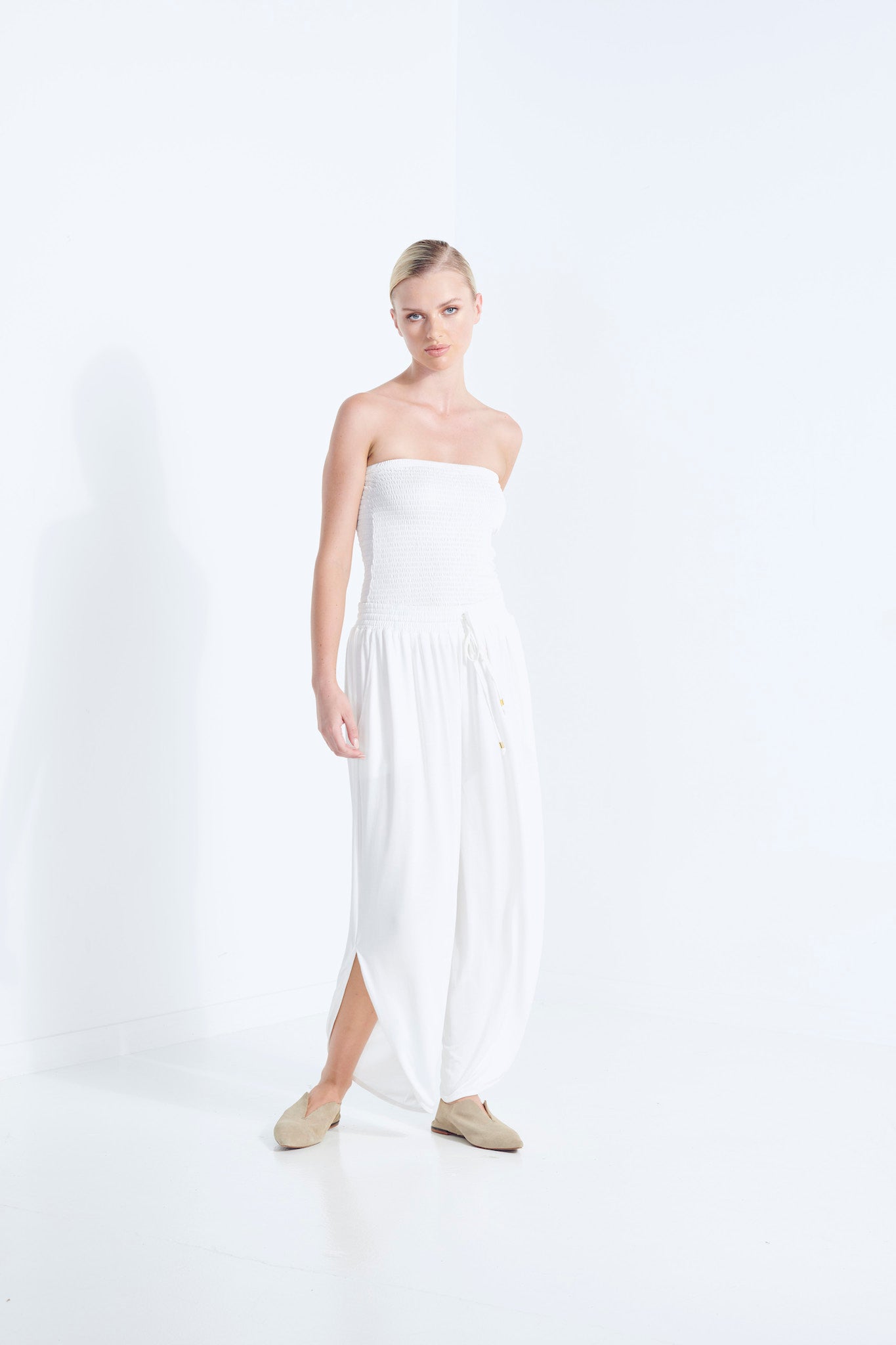 BELU PANT DEW MILKY WHITE LUXURY LOUNGEWEAR RELAXED KNIT PANTS WITH ELASTIC WAIST AND PETAL HEM SIDE FRONT VIEW
