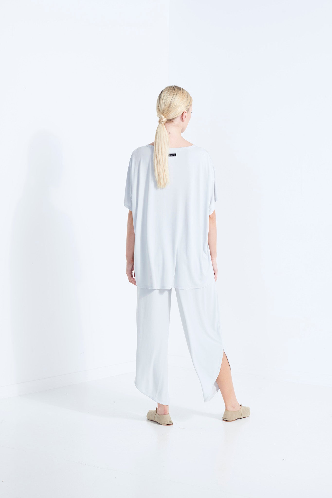 BELU PANT WISP PALE WASHED GREY LUXURY LOUNGEWEAR RELAXED KNIT PANTS WITH ELASTIC WAIST AND PETAL HEM BACK VIEW