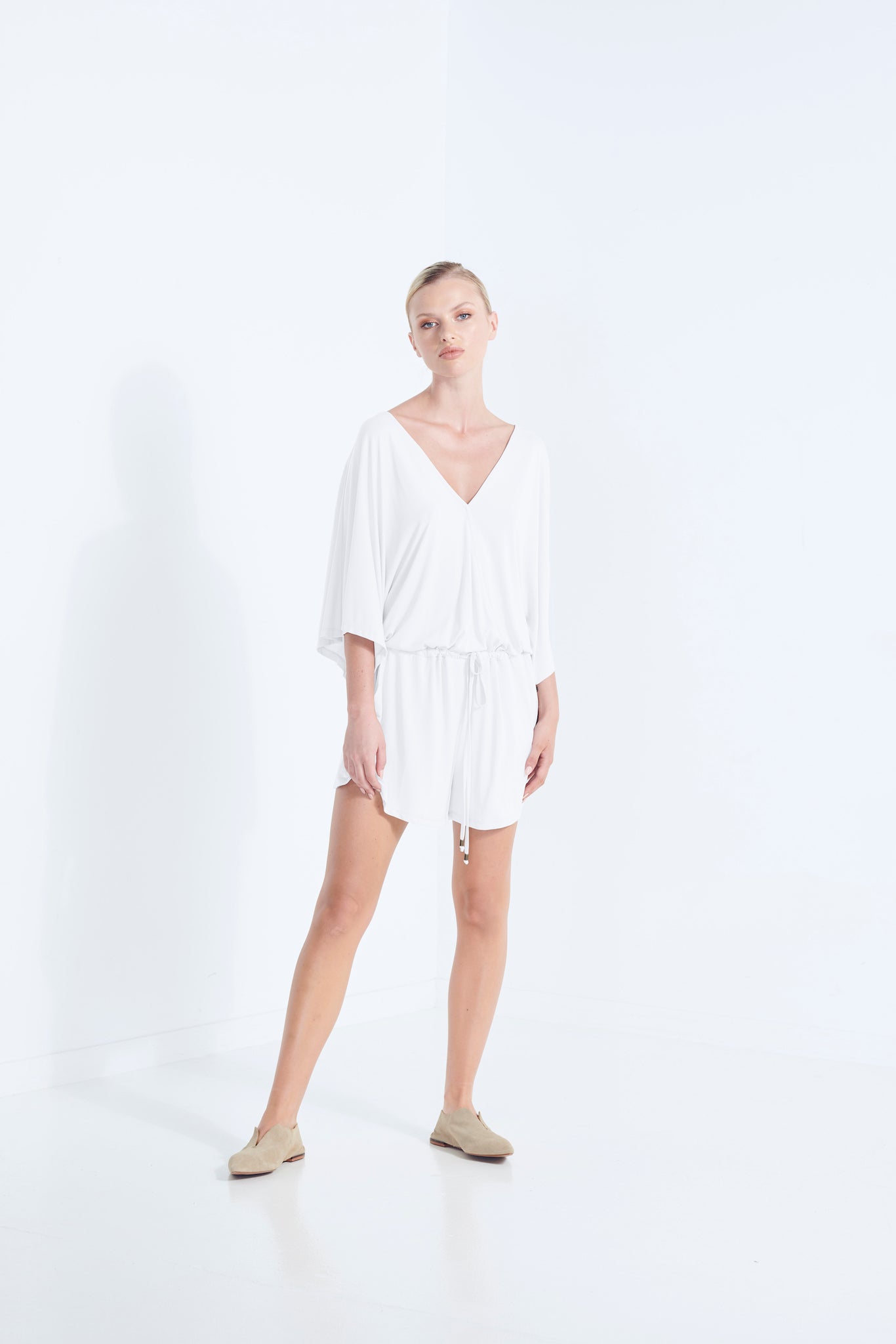 CARRIE PLAYSUIT BEECHWOOD MODAL STRETCH ROMPER  WITH WRAP FRONT TIE WAIST AND POCKETS IN MILKY WHITE DEW FRONT