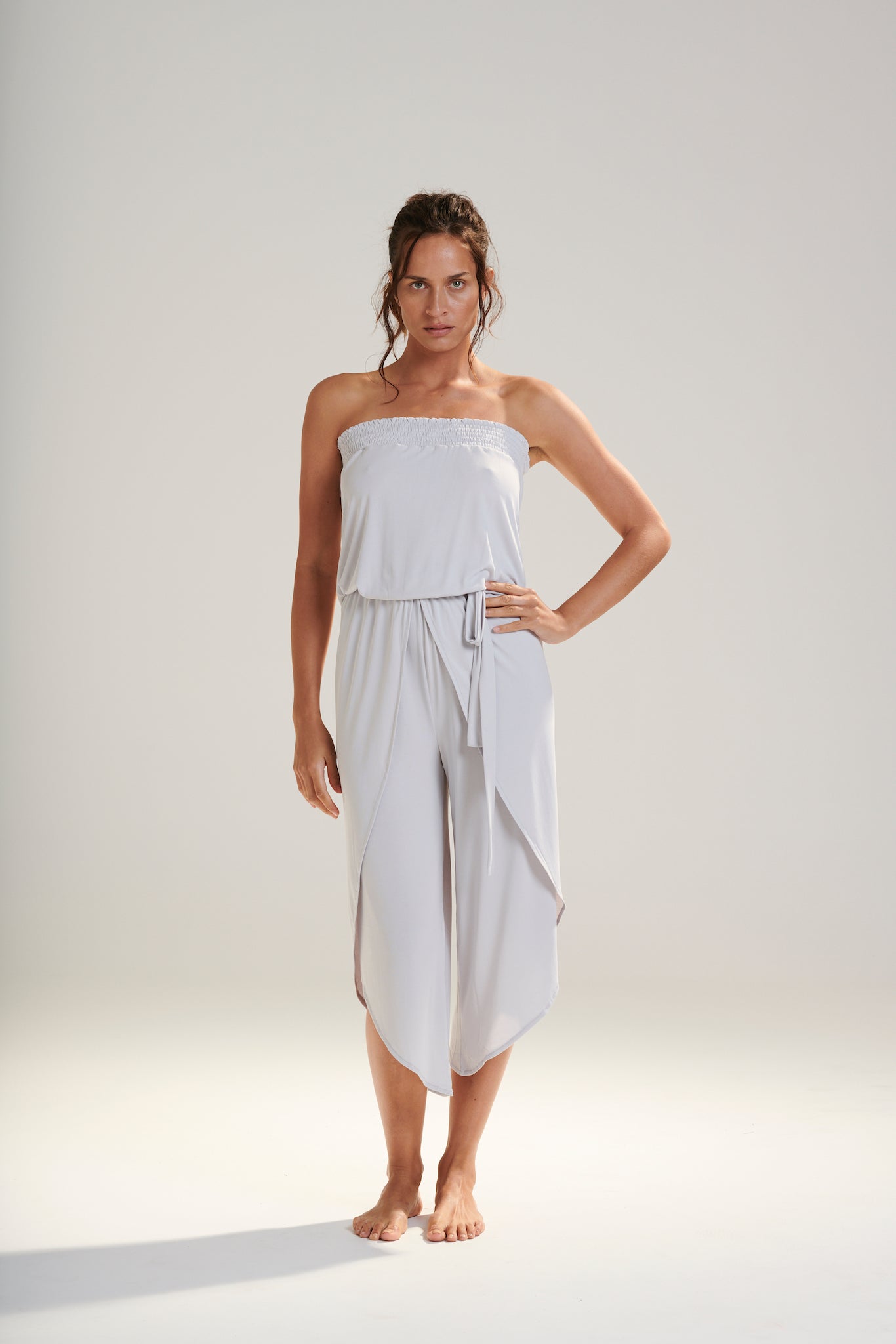 FREYA JUMPSUIT BEECHWOOD MODAL JERSEY SHIRRED BODICE AND PETAL WRAP LEG WITH ELASTIC WAIST AND REMOVABLE TIE IN WISP WASHED PALE GREY FRONT VIEW