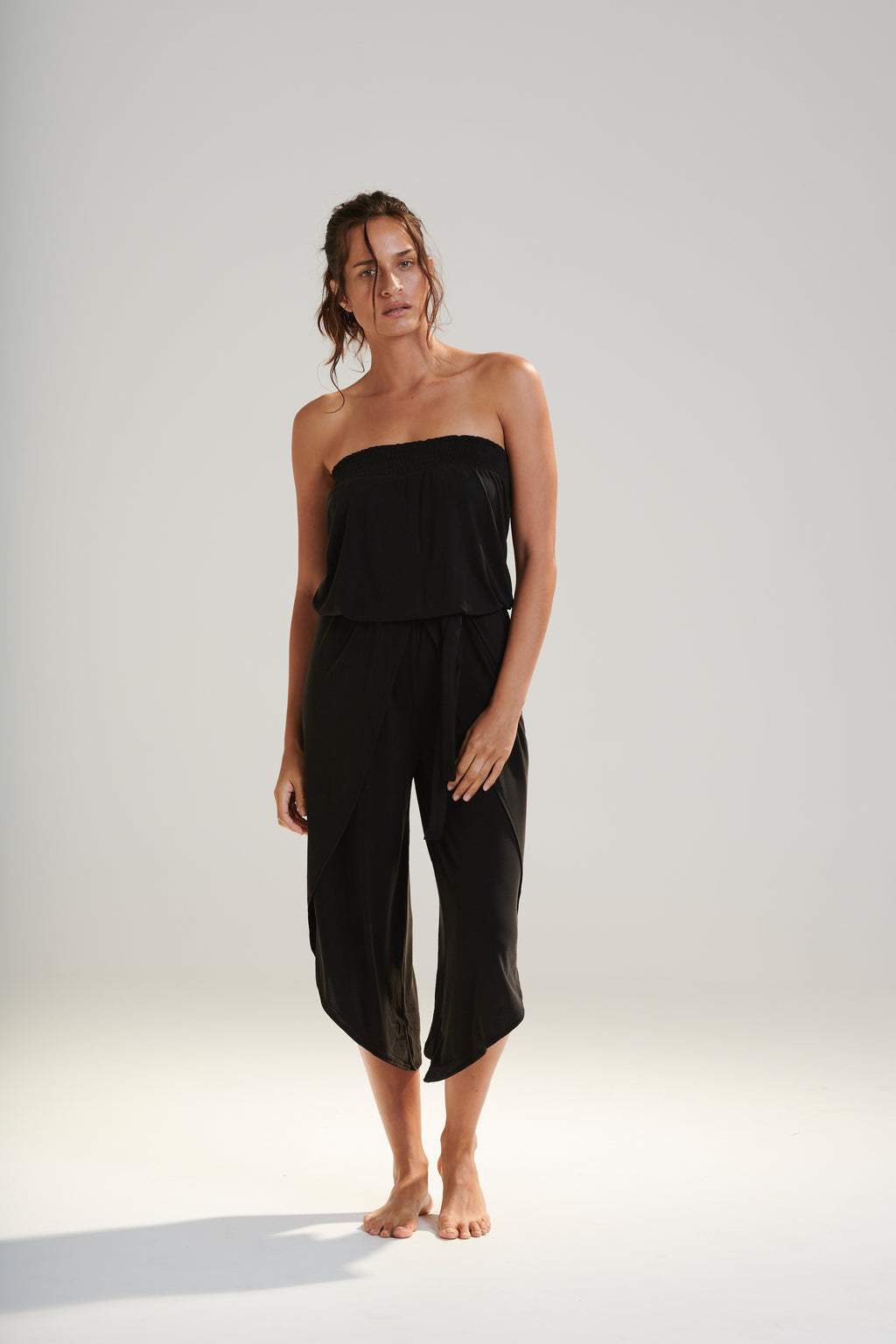 FREYA JUMPSUIT BEECHWOOD MODAL JERSEY SHIRRED BODICE AND PETAL WRAP LEG WITH ELASTIC WAIST AND REMOVABLE TIE IN DARK WASHED BLACK FRONT VIEW