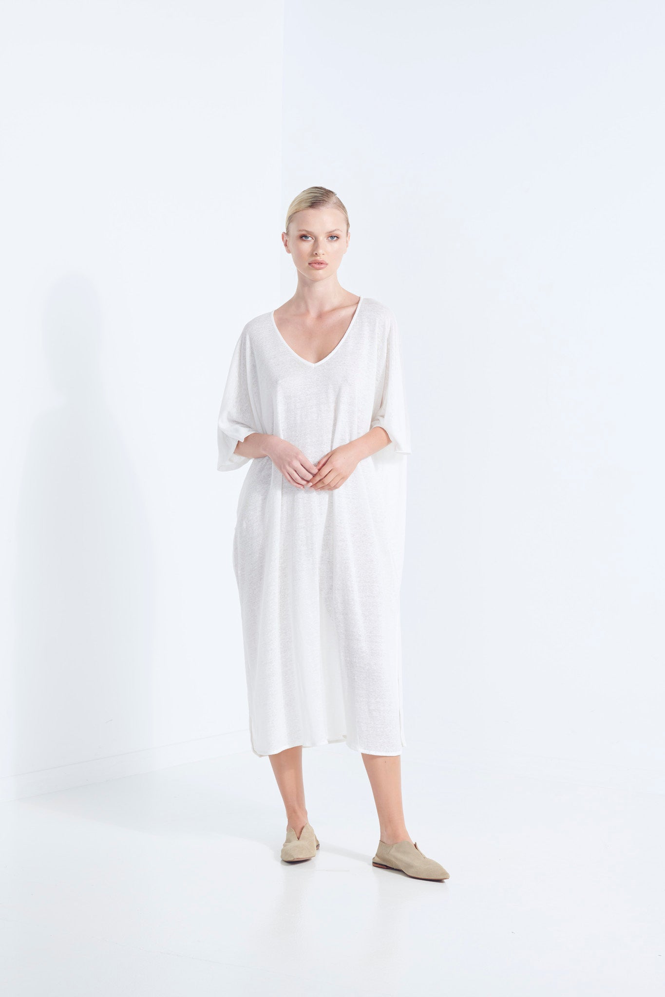 ZEUS DRESS PURE LINEN NATURAL YARN IN A MILKY ICE WHITE WITH SIDE HEM SCOOP AND SELF FABRIC TIE FRONT VIEW