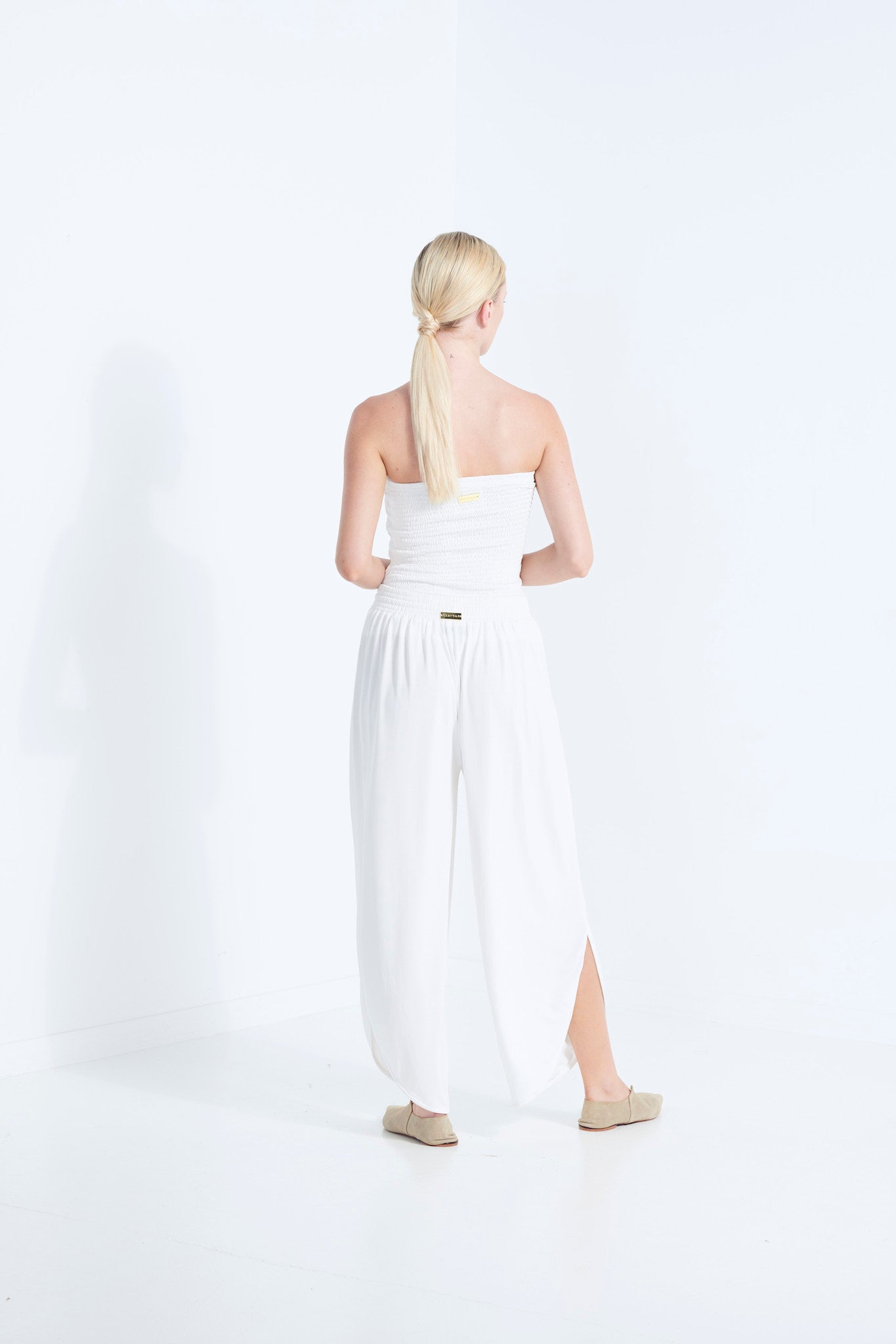 BELU PANT DEW MILKY WHITE LUXURY LOUNGEWEAR RELAXED KNIT PANTS WITH ELASTIC WAIST AND PETAL HEM SIDE BACK VIEW