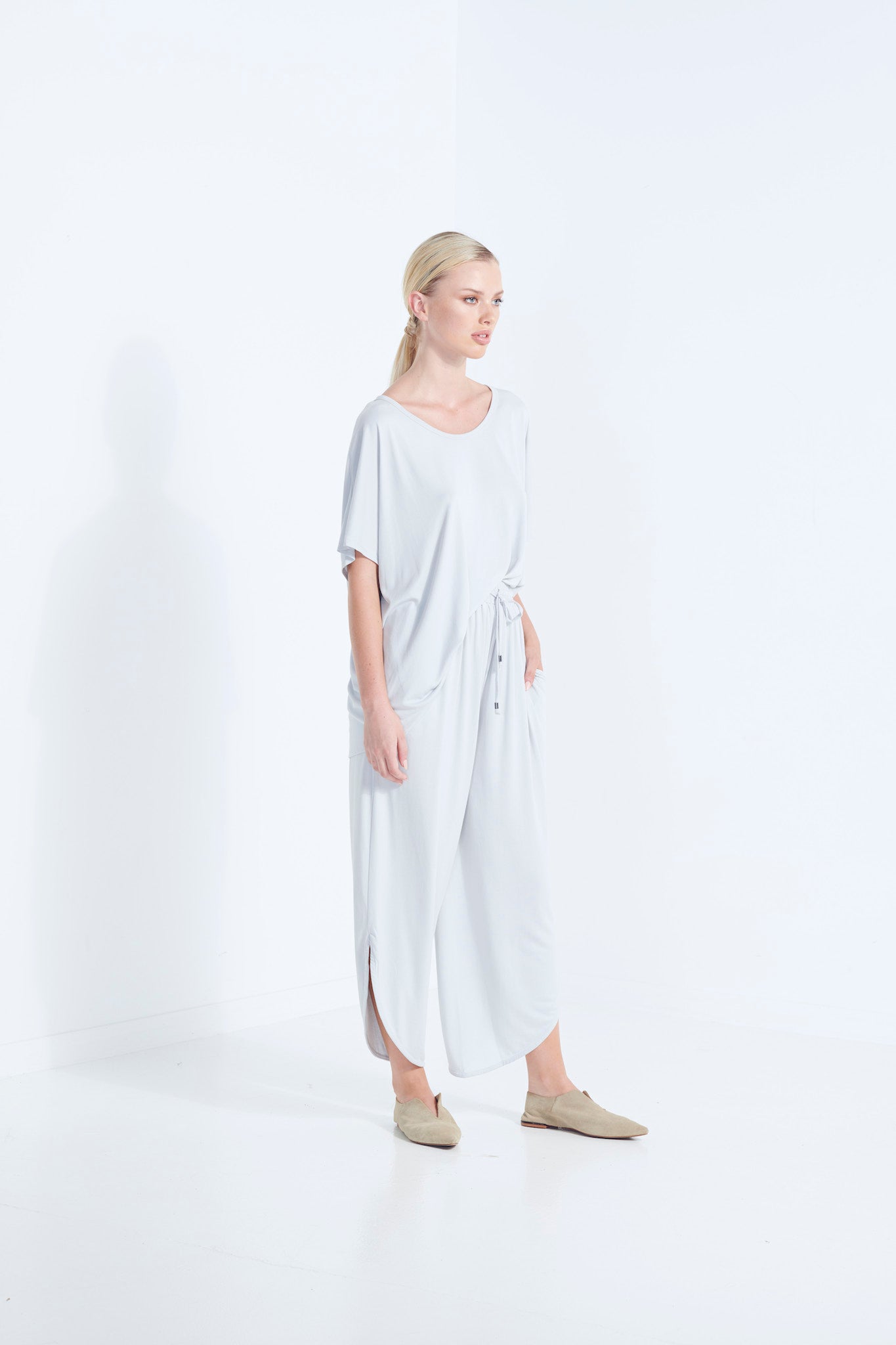 BELU PANT WISP PALE WASHED GREY LUXURY LOUNGEWEAR RELAXED KNIT PANTS WITH ELASTIC WAIST AND PETAL HEM SIDE  VIEW