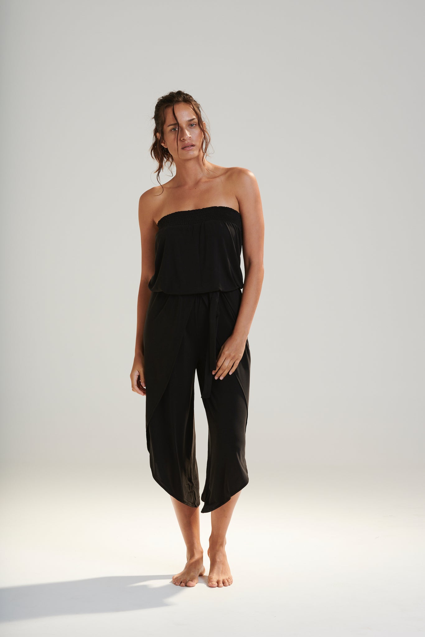 FREYA JUMPSUIT BEECHWOOD MODAL JERSEY SHIRRED BODICE AND PETAL WRAP LEG WITH ELASTIC WAIST AND REMOVABLE TIE IN DARK WASHED BLACK FRONT VIEW
