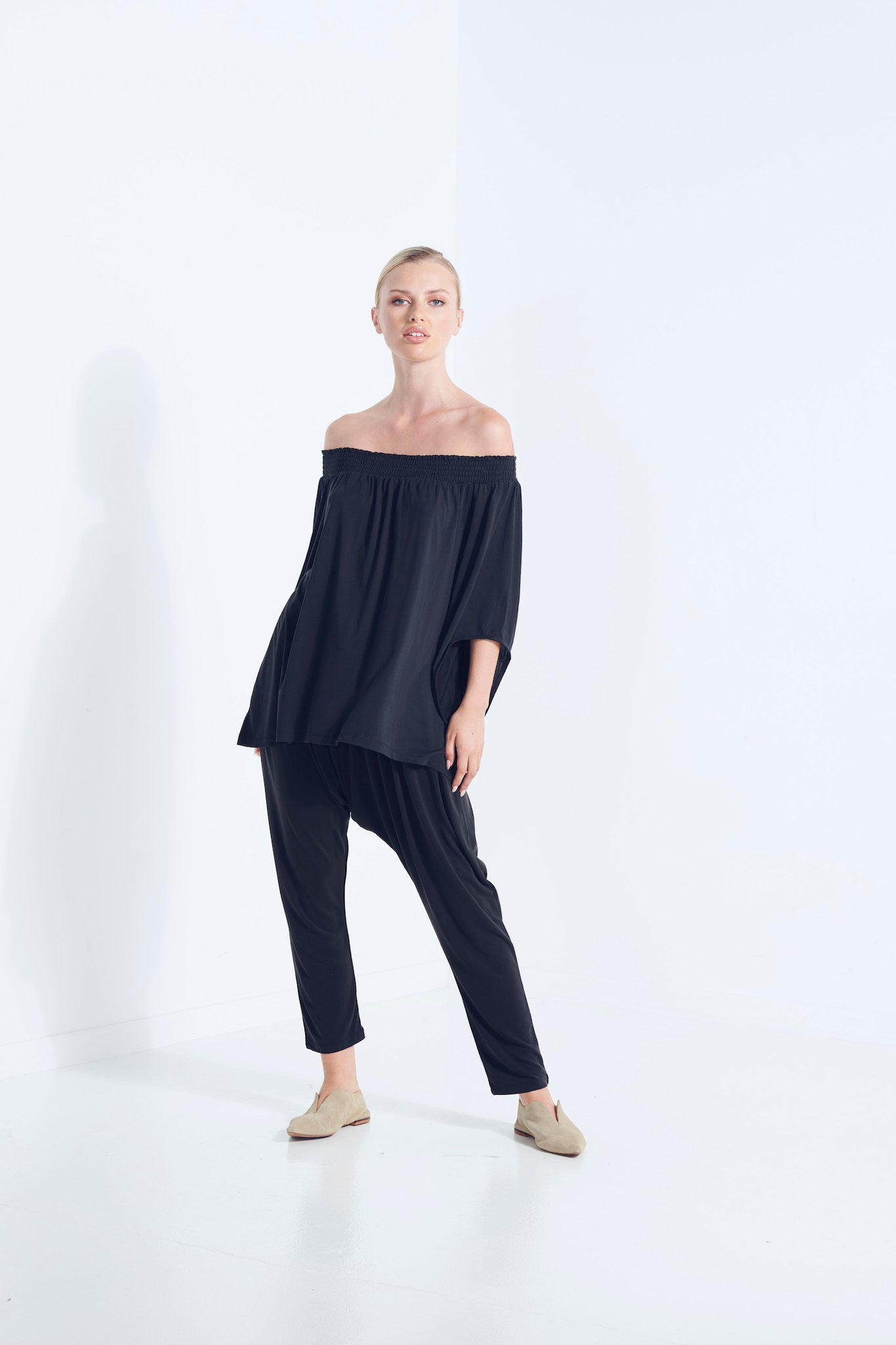 NAEVIA OFF SHOULDER TOP KNIT BEECHWOOD MODAL ELASTIC TOP WITH BELL SLEEVE DARK WASHED BLACK MOVEMENT VIEW